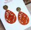 Picture of Ornament-Ohrstecker - Tropfenform aus Resin - flame orange - Stecker Edelstahl gold